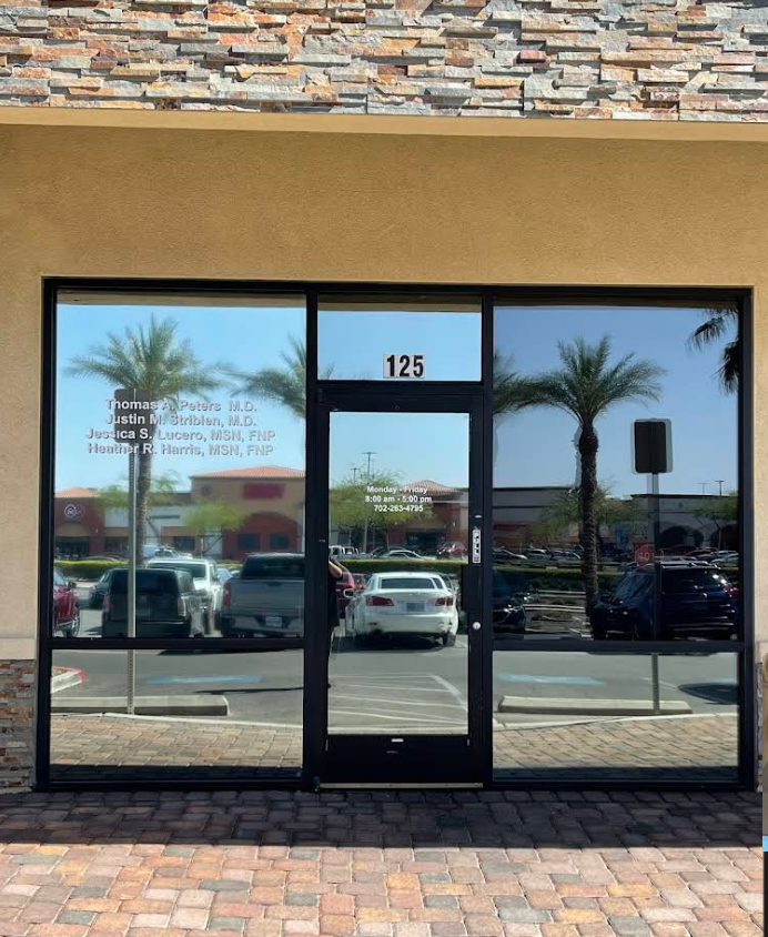 Commercial storefront with dark window film installed