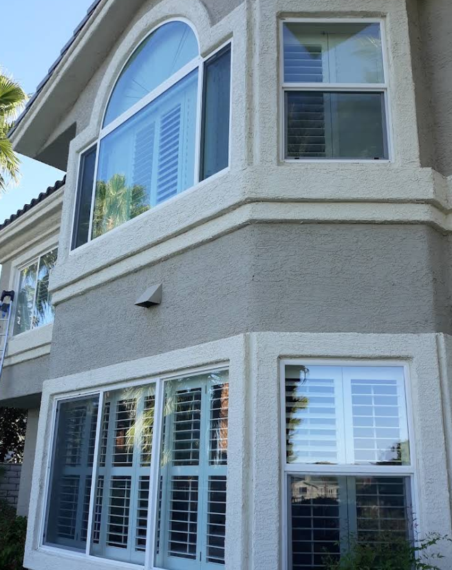 Residential exterior windows with window film installed